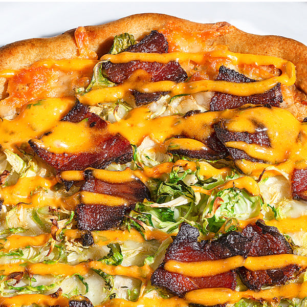 Cheesy Bacon and Brussels Pizza